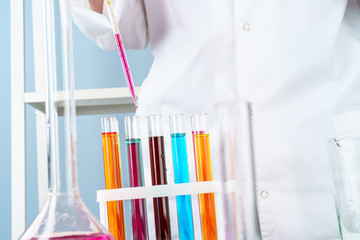 Scientist working with chemical samples in laboratory close up