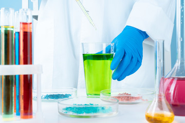 Scientific experiments in a chemistry lab.  Color liquids and test tube