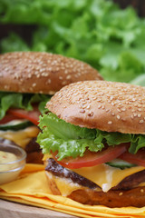 Two fresh hamburgers with vegetables