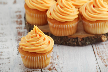 Cupcakes with orange icing on top