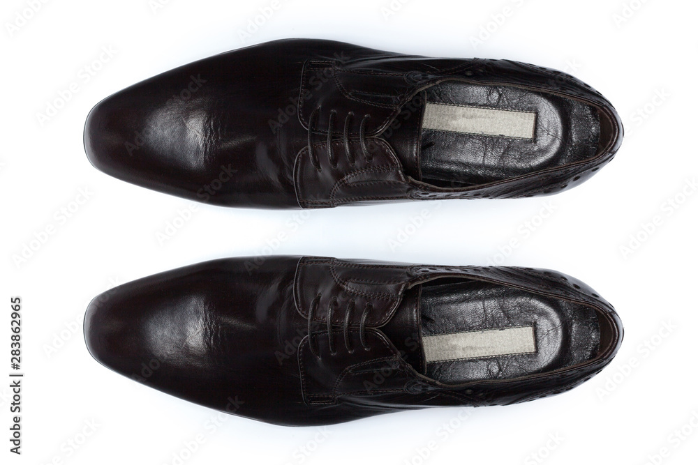 Wall mural Classic male leather shoes isolated on a white, top view.