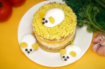 Themed holiday salad Mimosa with Cheese Mouse in honor of the 2020 new year on the Chinese calendar. Eastern horoscope. Traditional Russian holiday food - Mimoza. Selective focus.