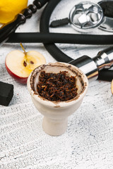 Parts of hookah and fruits on wooden background