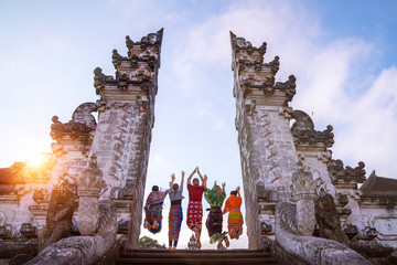 traveler jumping with energy and vitality in the gate of a temple © anekoho