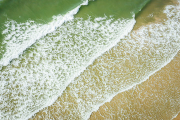 Aerial view of beach, sea waves and sand on baltic coast beach, nature background