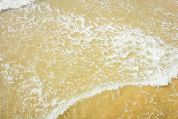 Aerial view of beach, sea waves and sand on baltic coast beach, nature background