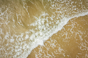 Aerial view of beach, sea waves and sand on baltic coast beach, nature background