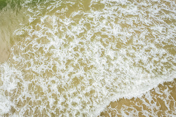 Aerial view of beach, sea waves and sand on baltic coast beach, nature background