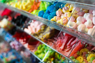 Variety of colored sweets on shelves