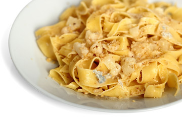 Pappardelle al Gorgonzola. Pasta (Fettuccine) with gorgonzola, pear, walnuts and white wine.