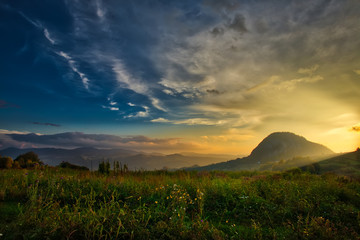 Mountain valley during sunset. Natural autumn landscape