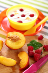 Fruit and Yogurt. The Healthy Eating. Peach, Raspberries.