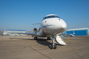 Business jet plane on the ground.
