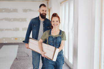 Happy young couple doing home improvements