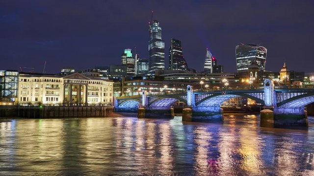 City Of London Skyline Timelapse Including 22 Bishopsgate, Walkie Talkie And Other Modern Skyscrapers At Night With The Illuminated Southwark Bridge In The Foreground. England, UK