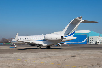 Business jet plane on the ground.