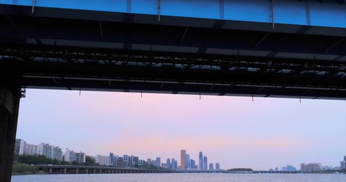 Tilting Shot Behind Bridge Disclosing Seoul City Skyline, Korea Drone