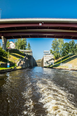 Lappeenranta, Finland - August 7, 2019: Lock and bridge on the Saimaa Canal at Malkia. View from water.
