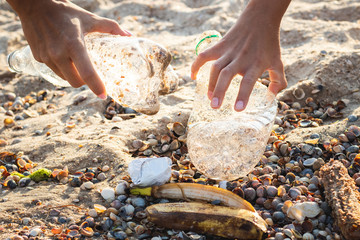 Garbage on the beach, waste picking concept