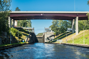 Lappeenranta, Finland - August 7, 2019: Lock and bridge on the Saimaa Canal at Malkia. View from water.
