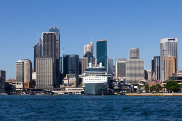 Fototapeta na wymiar Cruise ship moored in Sydney Harbour with the Central Business District behind, New South Wales, Australia