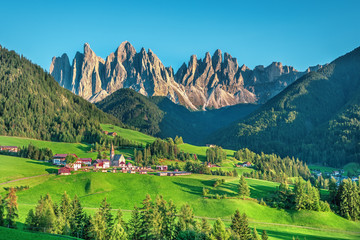 Famous alpine place  Santa Maddalena village with magical Dolomites mountains in background, Val di Funes valley, Trentino Alto Adige region, Italy