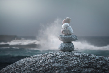 Calming zen rock stack by the ocean - obrazy, fototapety, plakaty