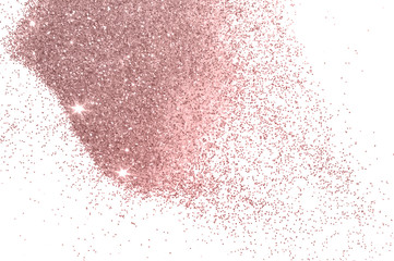 Pink glitter sparkles on white background