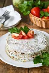 Zucchini cake with tomatoes and fresh parsley