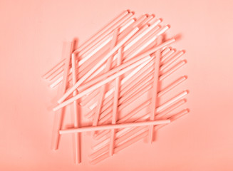 Plastic flexible straws coral color party on a sunny day