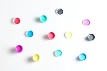 acrylic paint in cans on a white background. flat lay