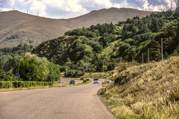 Fototapeta na wymiar Turn on the road leading to the high-mountain lake Sevan in Gegharkunik region of Armenia