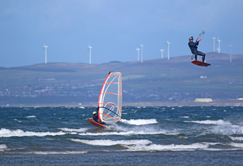 Kitesurfer and windsurfer riding off Barassie Beach, Troon