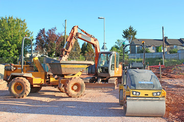 Dump truck and digger on a road construction site