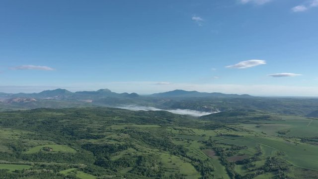 Blue sky above valley of Carpathian mountain ranges in Eastern Serbia 4K aerial video