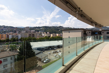 Fototapeta na wymiar Luxury apartment balcony with city view