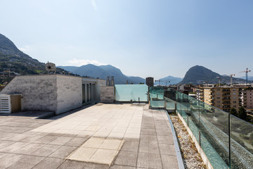 Fototapeta na wymiar Private terrace with city and mountain views
