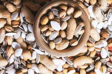 Naklejka premium set of nuts sore wooden background