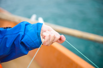 Hand holding fishing line