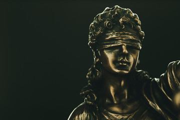 Brass statuette of Justice wearing a blindfold