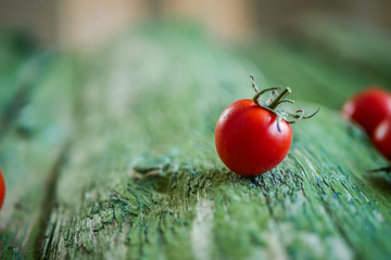 red tomato on wooden background close-up