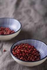 Close-up of pink pepper in a bowl