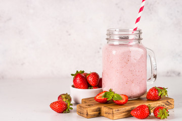 Strawberry milkshake or smoothie in mason jar.