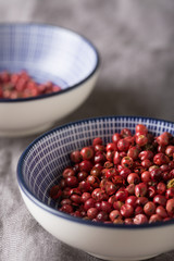 Close-up of pink pepper in a bowl