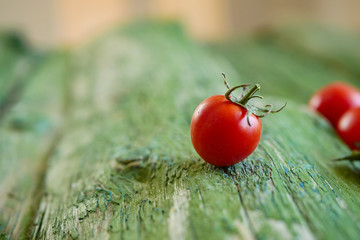 red tomato on vintage background close-up