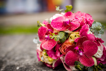 Beautiful bouquet of fresh flowers on a stone slab.