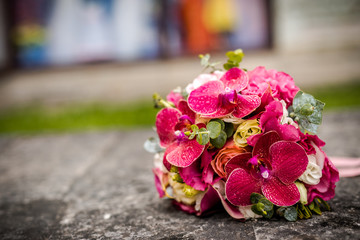 Beautiful bouquet of fresh flowers on a stone slab.