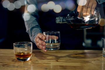 bartender pouring beer in glass