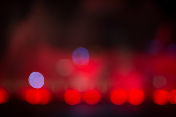 Fountain show with red bokeh color light illumination abstract.