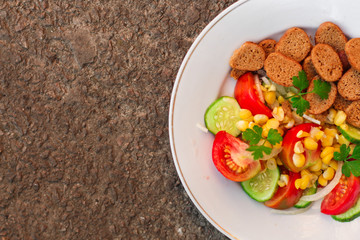 Healthy salad, leaves mix salad (breadcrumbs, corn, mix micro greens, cucumber, tomato, onion, other ingredients). food background. copy space